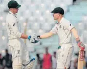  ?? AP ?? Peter Handscomb (left) and David Warner put on an unbeaten 127run stand for the third wicket in Chittagong on Tuesday.