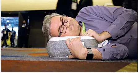  ?? Washington Post/JHAAN ELKER ?? Geoffrey A. Fowler is seen with the Somnox, a robot that serves as a sleep companion.