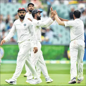  ??  ?? Indian players celebrate wicket of Australia's Josh Hazlewood during third day of the first Test at the Adelaide Oval on Saturday