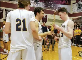  ?? BARRY TAGLIEBER - FOR MEDIANEWS GROUP ?? Pope John Paul II’s Drew McKeon, right, Dave Smrek, center, and Justin Green look at the District 1 championsh­ip trophy after winning the 4A title Saturday at Lower Merion.