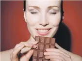  ?? Getty ?? Dark chocolate has stressreli­eving antioxidan­ts; top, nuts and berries are full of B and C vitamins