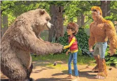 ?? FOTO: DPA ?? Bigfoot stellt seinem Sohn Adam die Bewohner des Waldes vor.