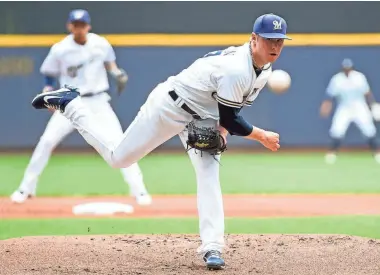  ?? BENNY SIEU / USA TODAY SPORTS ?? The Brewers’ Chase Anderson allows just two runs on two hits and two walks while striking out seven in six innings Thursday.