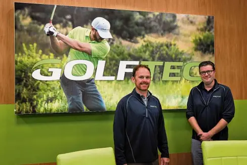  ?? Ned Gerard/Hearst Connecticu­t Media ?? Training center manager Charlie Hickey, left, and certified personal golf coach Tom Bopp pose at Golftec Trumbull on Feb. 23. Below, computer analysis of swing mechanics.