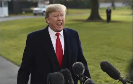  ?? SUSAN WALSH — THE ASSOCIATED PRESS ?? President Donald Trump speaks to reporters before boarding Marine One on the South Lawn of the White House in Washington, Monday before heading to Utah. Trump will be announcing plans to scale back two sprawling national monuments in Utah, responding...