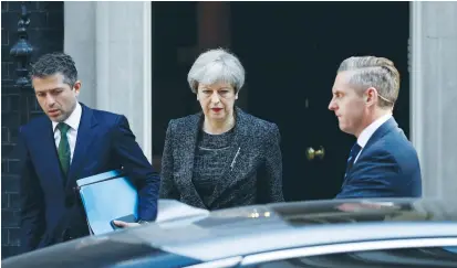  ?? (Reuters) ?? BRITISH PRIME MINISTER Theresa May leaves 10 Downing Street in central London yesterday.