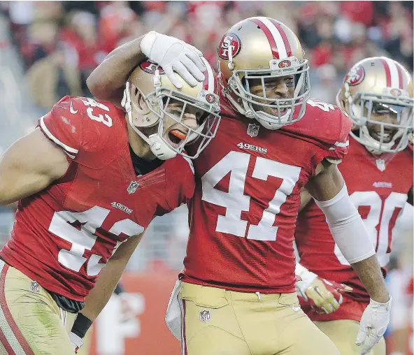  ?? — AP FILES ?? Defensive back Marcus Cromartie, centre, seen here with the San Francisco 49ers, has signed with the Seattle Seahawks.