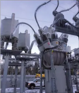  ?? The Canadian Press ?? A BC Hydro substation in the Fraser Valley is seen encased in ice. About 2,200 customers are still without power, some for as long as four days.