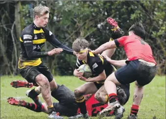  ?? ?? Lachlann MacKinnon stays in possession as team mate Fergus MacIntyre rushes to back him up.