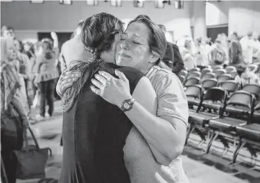  ?? Photos by Jon Shapley / Staff photograph­er ?? Jules Woodson, right, hugs Rachael Denholland­er after a panel discussion about sexual abuse and Southern Baptist churches on Monday, the eve of the Southern Baptist Convention meeting in Birmingham, Ala.