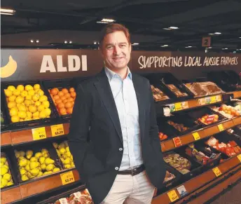  ?? ?? Aldi chief executive Tom Daunt at an Aldi store in Chatswood. Picture: John Feder