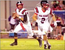  ??  ?? Blackhawk Zaine Holley (No. 2) protects Pea Ridge quarterbac­k Jakota Sainsbury (No. 14) as he looks for an open receiver.