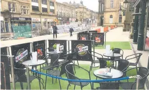  ??  ?? A picture submitted to the committee showing what the Accrington Pals Outdoor Cafe seating area in front of the Market Hall would look like