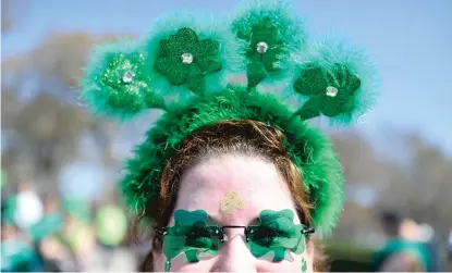  ?? GETTY IMAGES FILE ?? Maybe next year we can get back out there and dress up for Chicago’s St. Patrick’s Day parade, like this woman did in 2012. The parade was canceled this year, as it was last year, due to COVID-19.