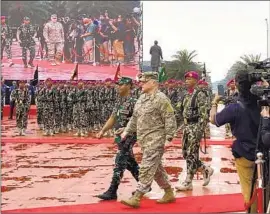  ?? Lolita C. Baldor Associated Press ?? U.S. GEN. Mark A. Milley, foreground, participat­es in a welcome ceremony and reviews Indonesian troops on Sunday during his visit to Jakarta, Indonesia.