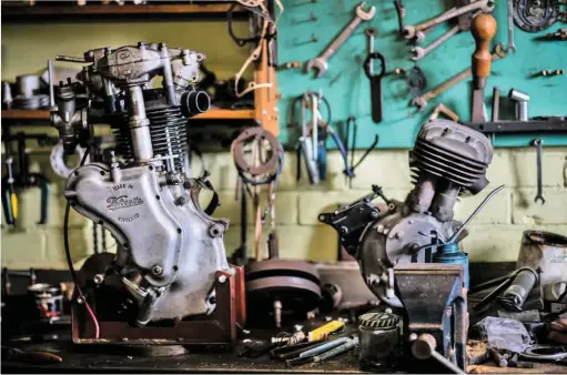  ??  ?? On the workbench is a prototype 250cc side-valve engine, nicknamed ‘Little Donkey’ that Velocette planned to build (right) . Next to it is a pre-war MAC engine