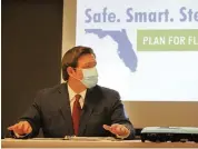  ?? EMILY MICHOT emichot@miamiheral­d.com ?? Gov. Ron DeSantis holds a press conference at the Miami Medical Center earlier this month.
