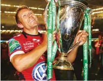  ??  ?? Captain marvel: Jonny Wilkinson raises the Heineken Cup