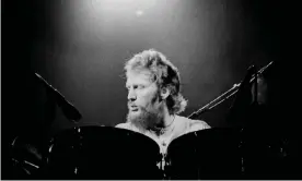  ?? Photograph: Colin Fuller/Redferns ?? Ginger Baker performing with Baker-Gurvitz Army in the mid-1970s.