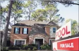  ?? Associated Press ?? A real estate sign at a home for sale in April in Houston.