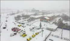  ?? GOVERNOR OF KEMEROVO REGION PRESS OFFICE PHOTO via AP ?? Ambulances and fire trucks are parked near the Listvyazhn­aya coal mine out of the Siberian city of Kemerovo, Russia, Thursday, after a fire in a coal mine.