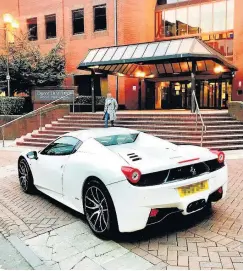  ??  ?? > The Ferrari belonging to Khan parked outside the courthouse