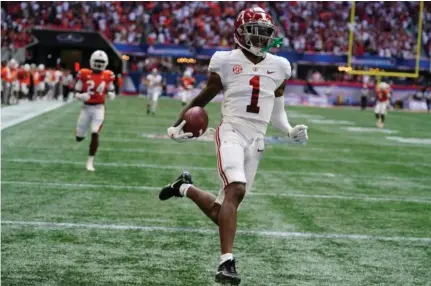  ?? (AP Photo/John Bazemore) ?? Alabama wide receiver Jameson Williams (1) scores after a catch during the second half of an NCAA college football game against Miami, Saturday, Sept. 4, 2021, in Atlanta.