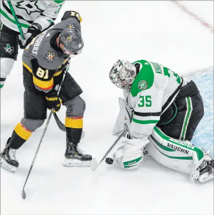  ?? Jason Franson The Associated Press ?? Jonathan Marchessau­lt tries to convert one of the Knights’ few chances, but goaltender Anton Khudobin comes up with a first-period save.