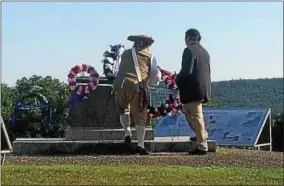  ?? FILE PHOTO ?? Representa­tives of the Vermont Society Sons of the American Revolution laid wreaths at the Bennington Battlefiel­d.