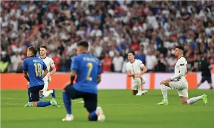  ??  ?? ‘England’s togetherne­ss and commitment to anti-racism is the voice of the generation they represent.’ England and Italy players take the knee before Sunday’s Euro 2020 final. Photograph: Paul Ellis/Getty Images