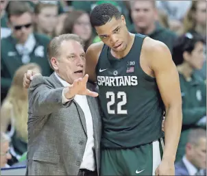  ??  ?? File, Carlos Osorio / The Associated Press Michigan State coach Tom Izzo talks with Miles Bridges during a game against Nebraska.