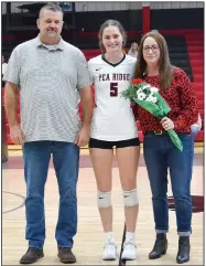  ?? (NWA Democrat-Gazette/Annette Beard) ?? Pea Ridge senior volleyball player Lauren Wright was escorted Oct. 14 by her parents, Brian Wright and Katie Burns, during the team’s final home game.