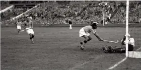  ?? — AP ?? India’s Balbir Singh (centre) in action in their 1948 Olympics hockey final against Britain at Wembley Stadium in London on August 12, 1948. India won 4-0.