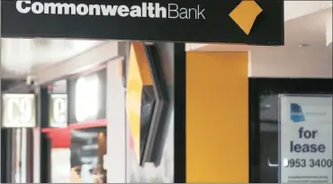  ?? PHOTO: BLOOMBERG ?? The Commonweal­th Bank of Australia logo displayed on a sign outside a branch in Sydney, Australia. The bank has been sued by the government’s financial crime agency over 53 700 alleged breaches of money laundering and terrorism financing laws.