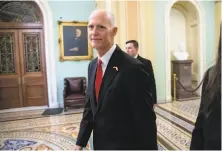  ?? J. Scott Applewhite / Associated Press ?? Rick Scott, the Republican candidate for Senate from Florida running against incumbent Democrat Sen. Bill Nelson, arrives Wednesday in Washington for meetings with GOP leaders. Senate races in Florida and Mississipp­i are still undecided.