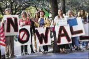  ?? NICK WAGNER / AMERICAN-STATESMAN ?? Protesters chant outside U.S. Sen. John Cornyn’s office in Austin on Wednesday. The Texas Sierra Club, United We Dream and the Austin Environmen­tal Justice Team organized the protest.