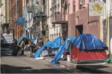  ??  ?? Homeless people have pitched tents in the Tenderloin, as San Francisco’s waiting list for a shelter spot is over 1,000.