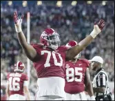 ?? Associated Press ?? Alabama offensive lineman Javion Cohen (70) signals a touchdown after a dive into the end zone by quarterbac­k Bryce Young against Tennessee on Saturday in Tuscaloosa, Ala.
