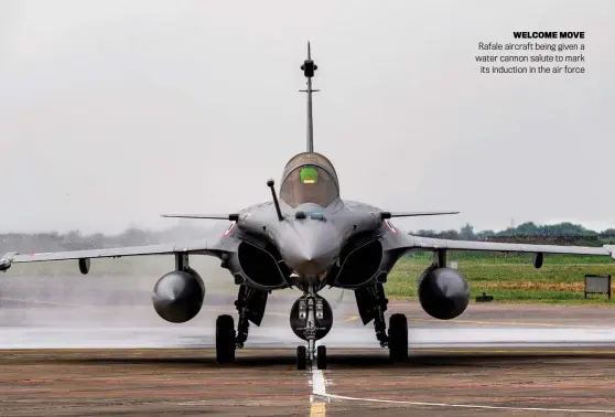  ?? ?? WELCOME MOVE Rafale aircraft being given a water cannon salute to mark its induction in the air force