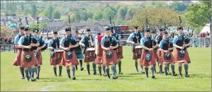  ?? Angus MacColl leads Oban High School Pipe Band. 06_a20gourock­games02 ??