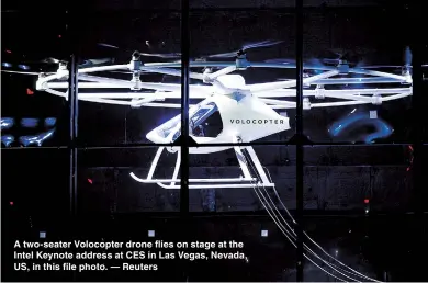  ??  ?? A two-seater Volocopter drone flies on stage at the Intel Keynote address at CES in Las Vegas, Nevada, US, in this file photo. — Reuters