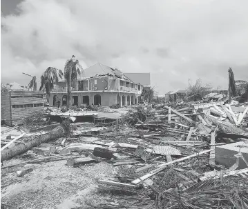  ?? PHOTOS: LIONEL CHAMOISEAU / AFP / GETTY IMAGES ?? The damage to Orient Bay is seen on the Caribbean island of St. Martin Thursday, after Hurricane Irma tore through it on Wednesday. The island, which is divided between the Netherland­s and France, saw the worst damage so far.