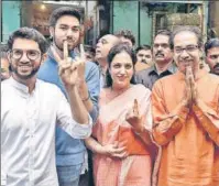  ?? BHUSHAN KOYANDE/KUNAL PATIL/HT PHOTO/ PTI ?? Haryana chief minister Manohar Lal Khattar on a bicycle in Karnal; NCP chief Sharad Pawar, his son-in-law Sadanand Sule and granddaugh­ter Revati Sule in Mumbai; wrestler Geeta Phogat with her sister and BJP candidate Babita Phogat (right) in Haryana’s Charkhi Dadri; and Shiv Sena chief Uddhav Thackeray with wife Rashmi and sons Aaditya Thackeray (left) and Tejas Thackeray in Mumbai on the polling day on Monday.