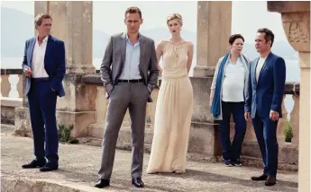  ??  ?? More Fleming than le Carré: from left, Hugh Laurie, Tom Hiddleston, Elizabeth Debicki, Olivia Colman and Tom Hollander in The Night Manager