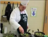  ?? DIGITAL FIRST MEDIA FILE PHOTO ?? Chef Richard Ray sautés Brussels sprouts during a visit to at East Vincent Elementary when Owen J. Roberts School District celebrated “Go for the Greens” week.