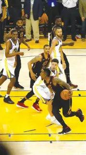  ?? — AFP ?? In this file picture, players of the Cleveland Cavaliers and the Golden State Warriors are in action during Game 1 of the NBA Finals. Both the teams will clash once again in the crucial Game 2 of the finals on Monday.