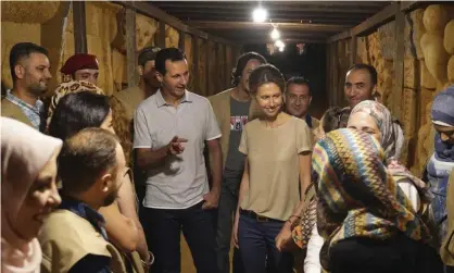 ??  ?? Syria’s president, Bashar al-Assad, and his wife, Asma, during a visit in 2018 to a tunnel dug by rebels in Jobar, near Damascus. Photograph: AP