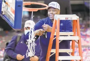  ?? FRANK FRANKLIN II/ASSOCIATED PRESS ?? Georgetown head coach Patrick Ewing cuts down the net after the Hoyas defeated Creigton to win the Big East Conference tournament on Saturday.