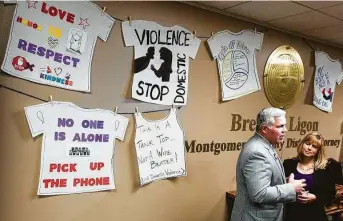  ?? Jason Fochtman / File photo ?? Montgomery County District Attorney Brett Ligon, left, talks about domestic violence challenges in the county with Sarah Raleigh, president and CEO of the Montgomery CountyWome­n’s Center.