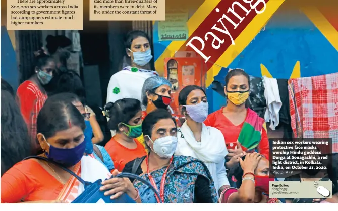  ?? Photo: AFP ?? Indian sex workers wearing protective face masks worship Hindu goddess Durga at Sonagachhi, a red light district, in Kolkata, India, on October 21, 2020.
